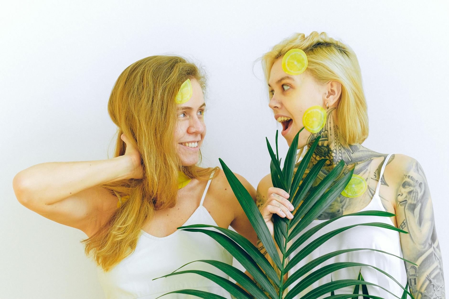 Yellow silicone vibrator on a yellow background surrounded by creative styling